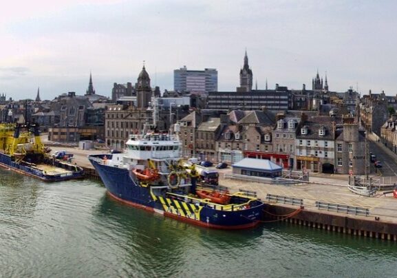 A shot of Aberdeen Harbour, with a boat and buildings