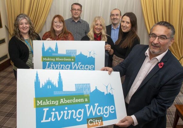 14/11/22
Councillor Christian Allard , Aberdeen City Council spokesperson on anti-poverty and inequality matters, including the Real Living Wage,holding the living wage pledge board along with  action group members, L-R  Jennifer Yeomans, NHS Grampian, Rachel Morrison-McMormick, Living Wage Scotland, 
Stuart Coupland,ACC &amp; Aberdeenshire Council Joint Procurement Team,, 
Julie Phillips - NHS Grampian , 
Martin Barry,  Scottish Enterprise
Shelley Mackenzie , SHMU,

Community Planning Aberdeen is holding its annual Aberdeen responsible business event in partnership with Business in the Community (BITC). The theme of the event will be surrounding the cost-of-living crisis and ways businesses can get involved in supporting communities and people within Aberdeen.